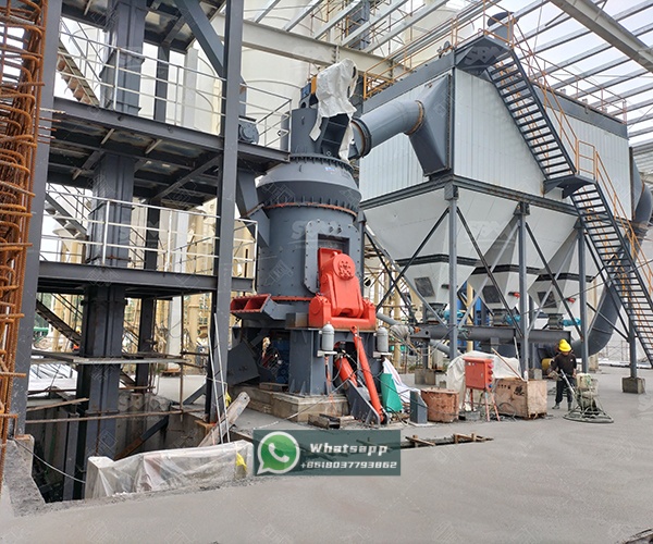 A modern industrial plant with vertical grinding mills in operation