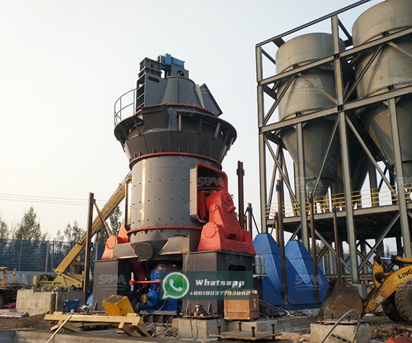 A large LM Vertical Grinding Mill installed in an industrial plant, showcasing its vertical structure and ancillary systems.