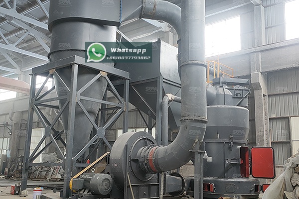 A large pile of raw petroleum coke at an industrial site