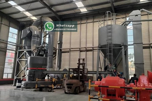 Fine zeolite powder being mixed into rubber compound in an industrial mixer