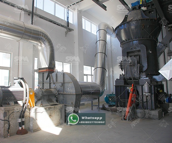 Installation view of a Zenith LM Vertical Grinding Mill in an industrial setting, showing its compact footprint and integrated system components.