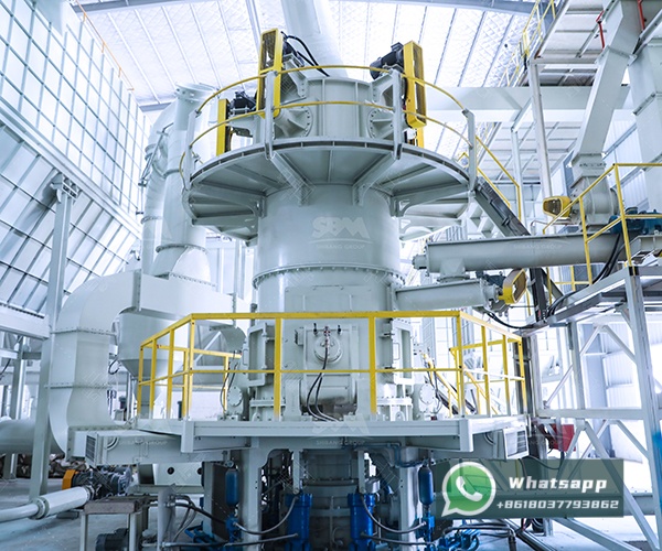 LUM vertical mill installed in a talc processing plant, with control panel and piping visible